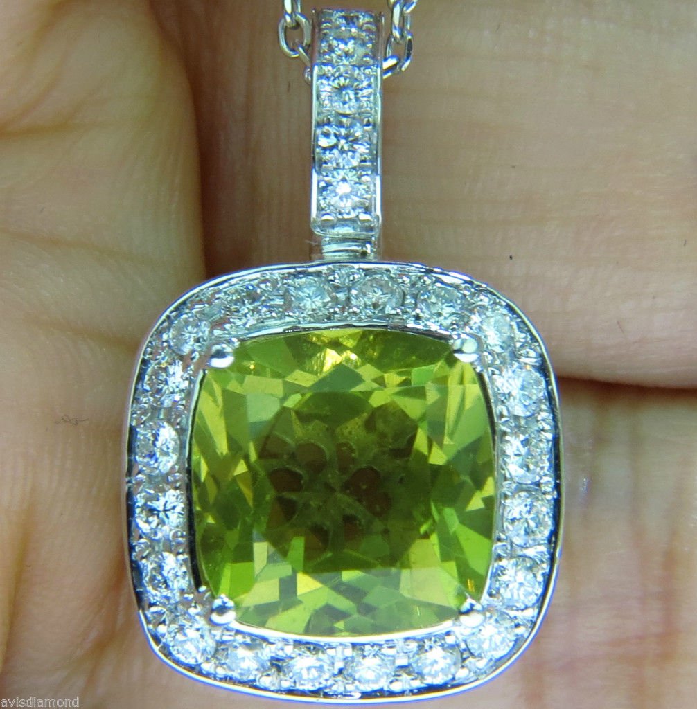 11CT NATURAL LEMON QUARTZ DIAMOND PENDANT 14KT: 10.00ct. Square Brilliant Natural Lemon QuartzClean clarity and vivid yellow sheen10.95 X 11.20mm 1.00ct. Diamonds. Vs-2 clarity, G-H colorEnjoy the Essence of Glamour BEAUTY!14kt. white gold.Necklace