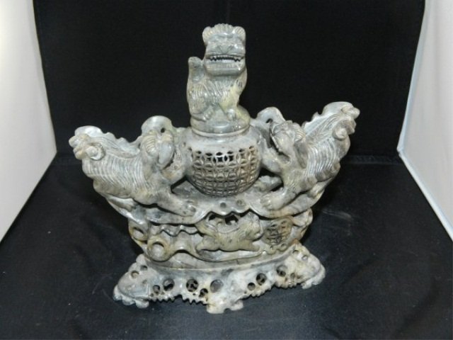 Carved Soapstone Incense Burner: Carved Soapstone Incense Burner Highly carved and detailed soapstone incense burner, depicting Fu Dogs to the side and lid, with heavily incised decorative features to the stand as well as burner. 8" 