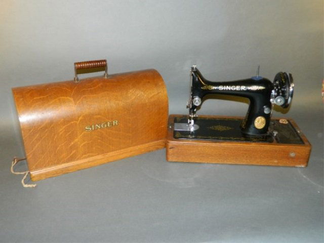 Singer Sewing Machine: with nice wooden box and key for the lock. Needs to be recorded.