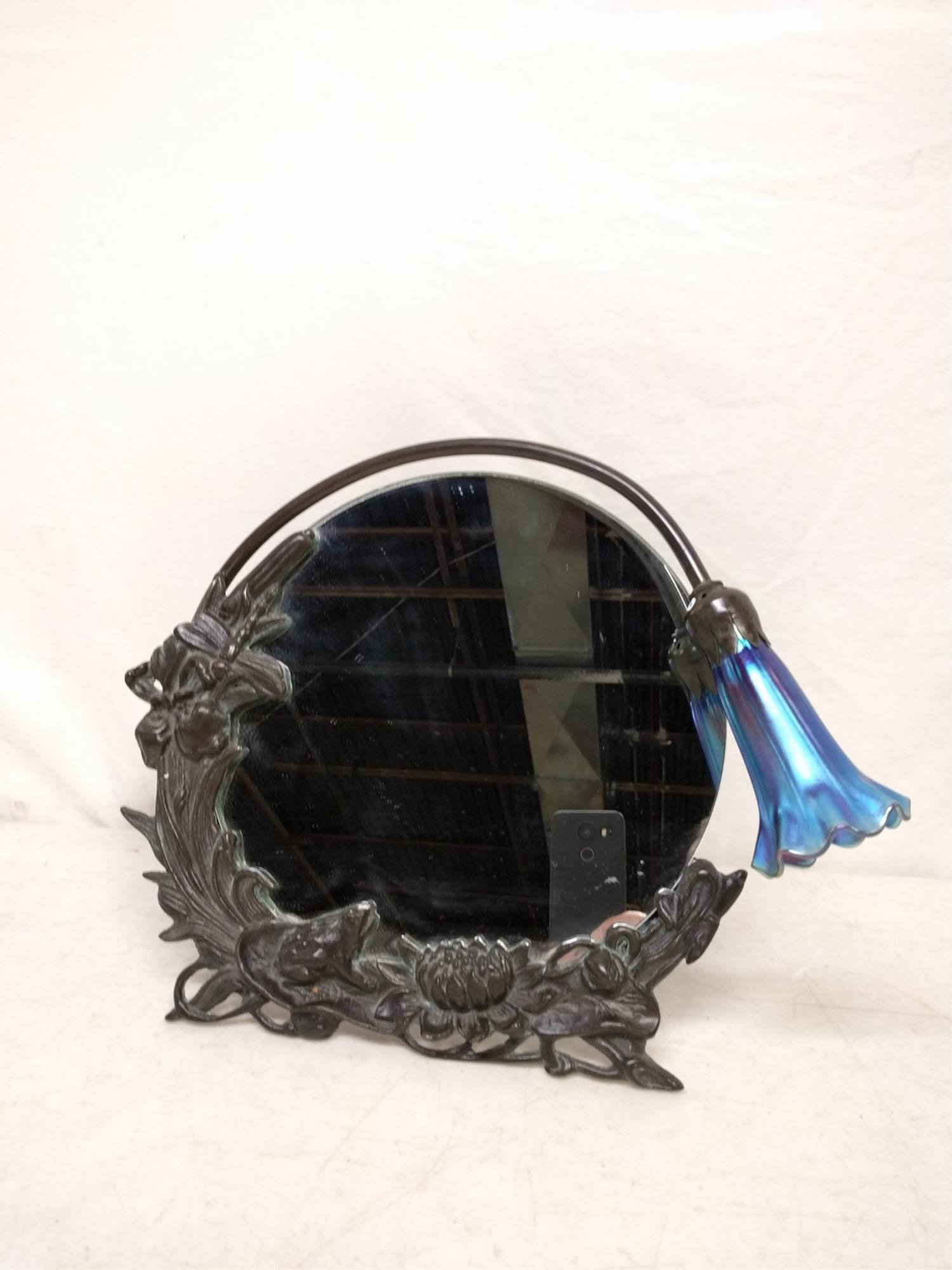Bronze Dragonfly lighted vanity mirror: Bronze Dragonfly lighted vanity mirror Blue iridescent shade works 13 1/2" W x 12 1/2" T magnet will NOT stick to it and it weighs alot heavier than aluminum