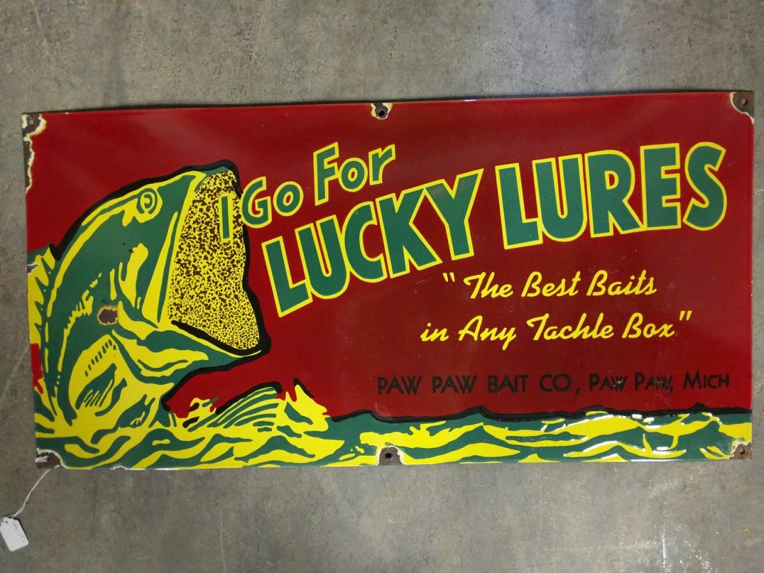 Porcelain "Go For Lucky Lures" sign: Porcelain "Go For Lucky Lures" sign Paw Paw Bait Co., single sided corrosiion around edges and holes 36" W x 18" T