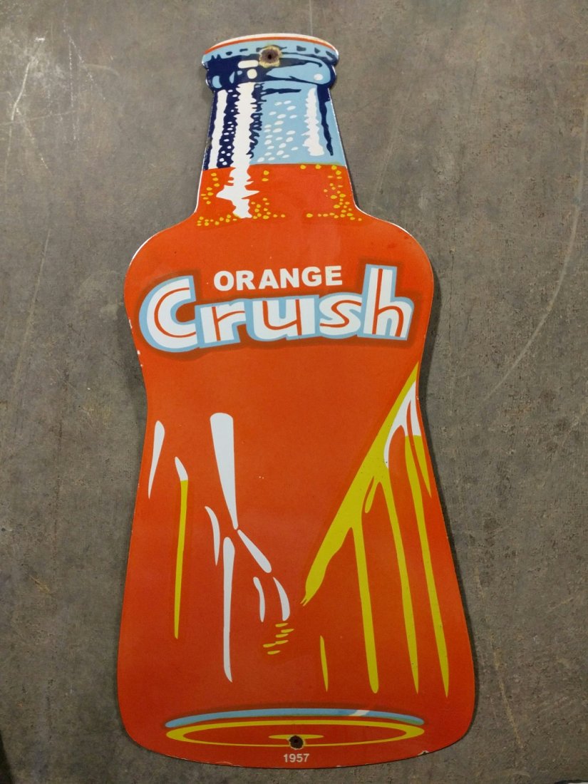 Porcelain Orange Crush Bottle Sign: Porcelain Orange Crush Bottle Sign dated 1957 single sided some corrosion on edges and holes 36" T x 17" W