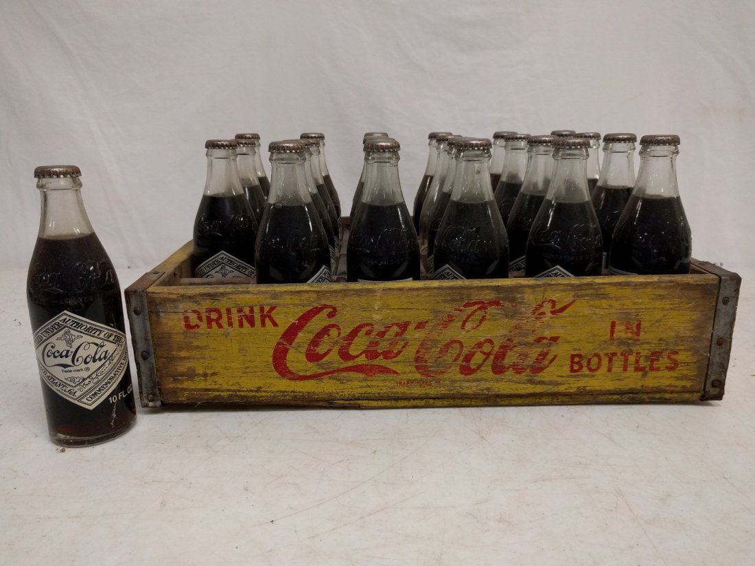 Vintage coca Cola Crate with 24 75th Anniversary Bottle: 18 1/2" L x 12" W x 4 1/4" T is in good conditiion
