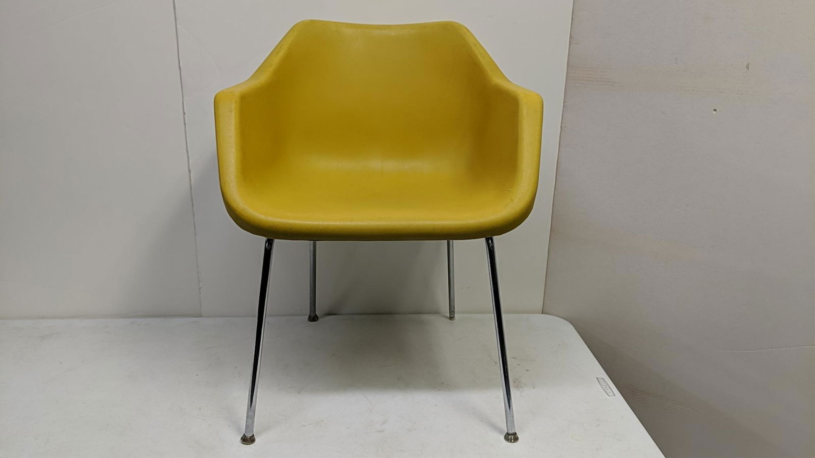 Mid Century Modern John Stuart Yellow Chair: Plastic seat and chrome legs and base licensed by Hille, London England 24" x 21 1/2" x 29 3/4" T Designed by Robin Day.