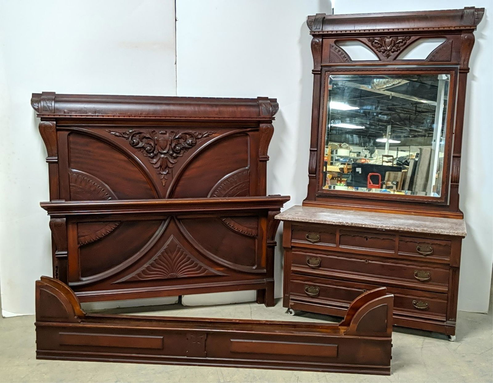 Victorian 3 pc. ornate carved bedroom suite: mahogany includes rails Full Size bed 65 3/4" W x 60 1/2" Mrble top dresser with mirror 48 1/4" w x 85" t x 31" D some small cracks in wood