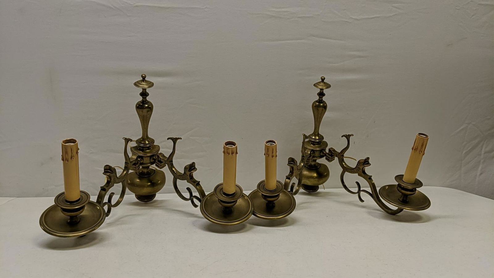 pair of brass dolphin wall sconces: 13 3/4" R x 14 " W x 12" D good condition wired to be mounted