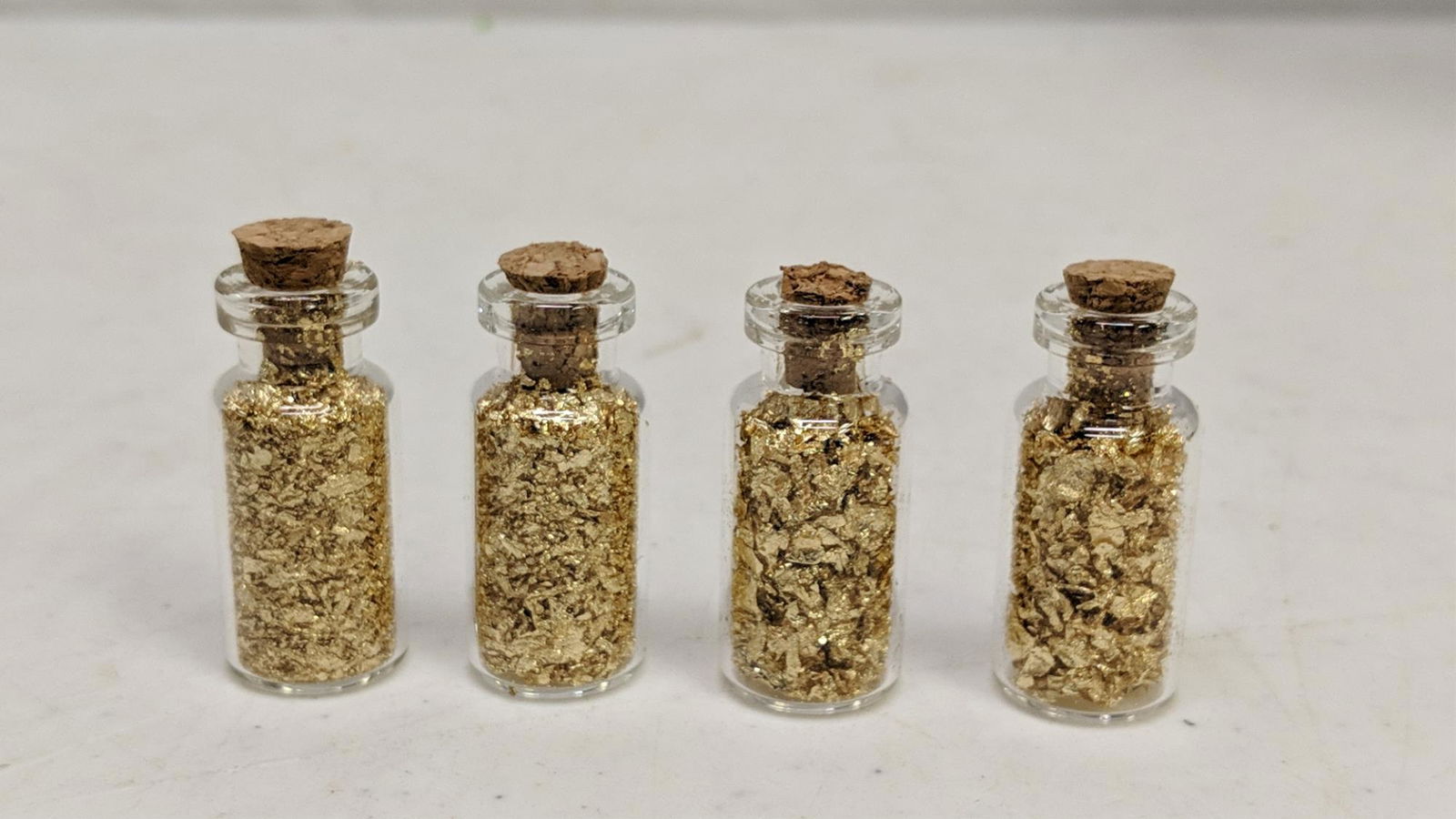 4 1 oz. vials 24 Kt. gold: flakes