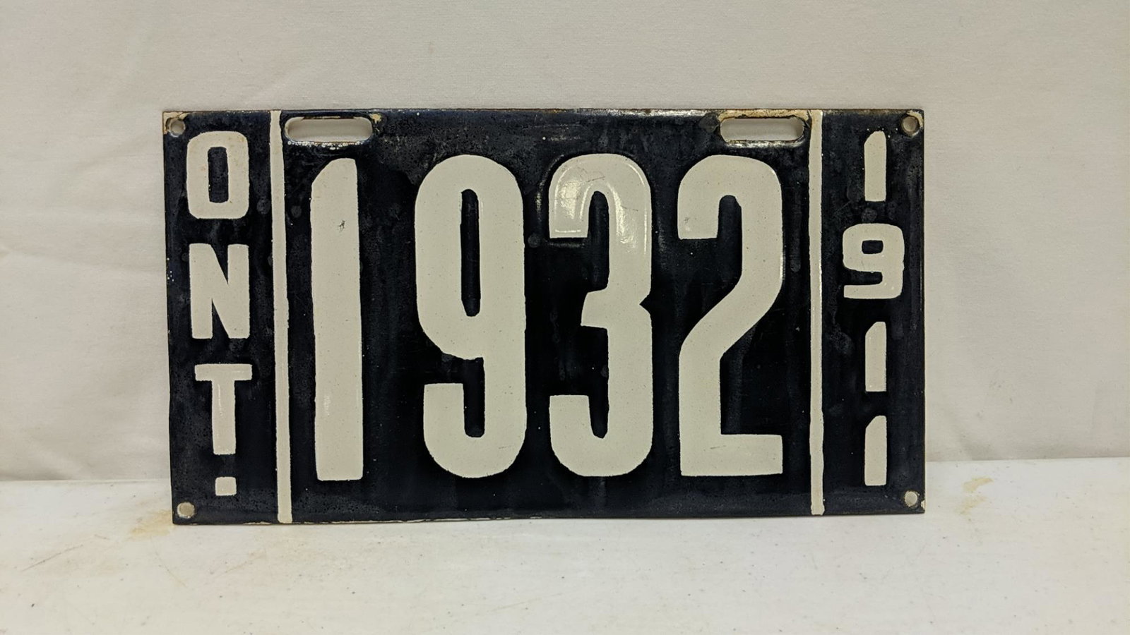 porcelain Canadian Tag or sign: 12" x 6" some corrosion