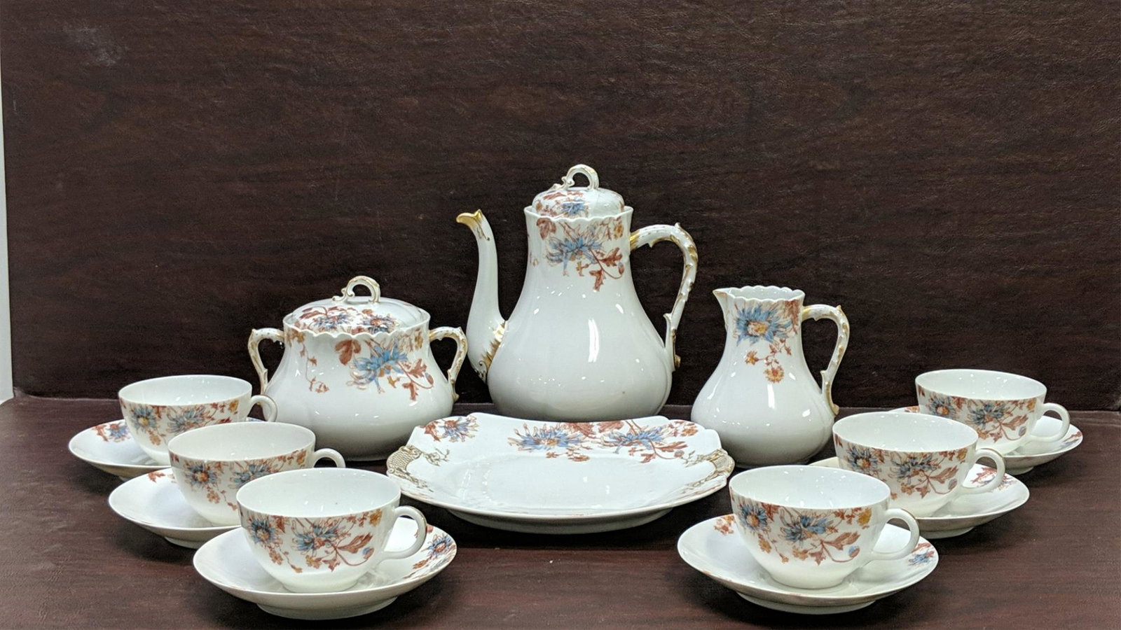 15 pieces C. H. Fields Co. Chocolate set: 1 plate measuring 9" x 9 1/4" , 6 cups and 6 saucers, large creamer and sugar all pieces are in good condition also marked GDM on bottom