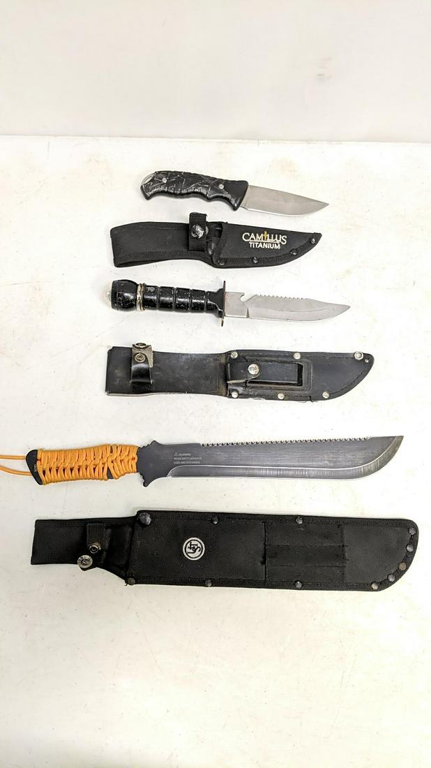 3 knives with scabbards: camillus titanium 9" long, Survival knife with a compass 11" long and Tactical knife 16 1/4" long all are slightly used