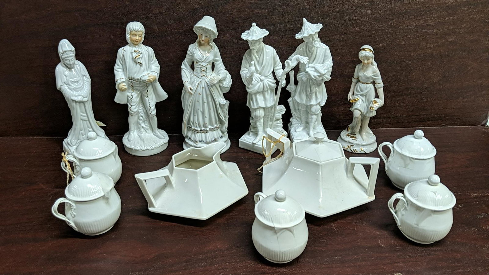 13 pcs. white porcelain: 6 figurines, 5 mini cups with lids, creamer and sugar