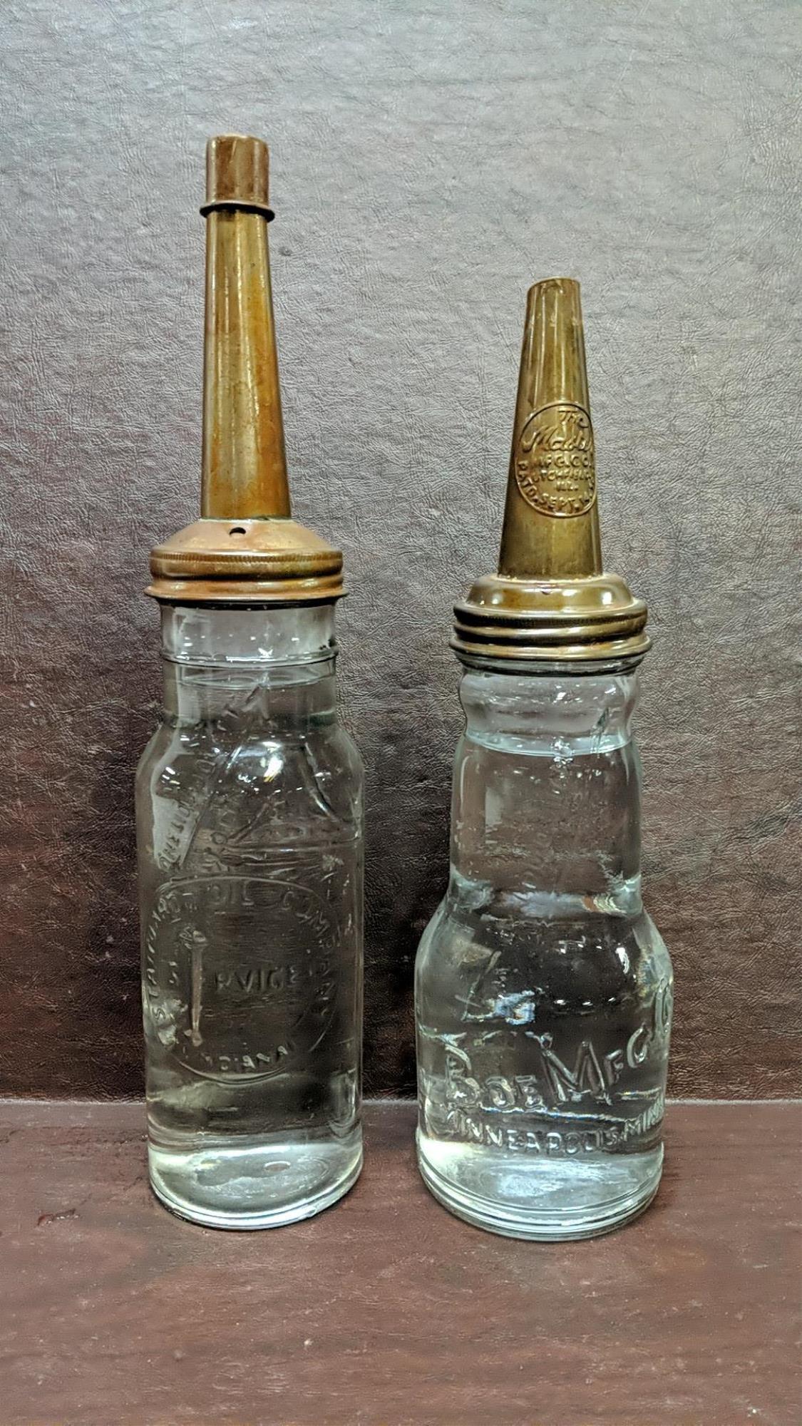 2 one quart oil bottles with funnel lids: 15 1/2" T Standard Oil Company and 13 3/4" Boe Mfg. Co., bottle both are in good condition