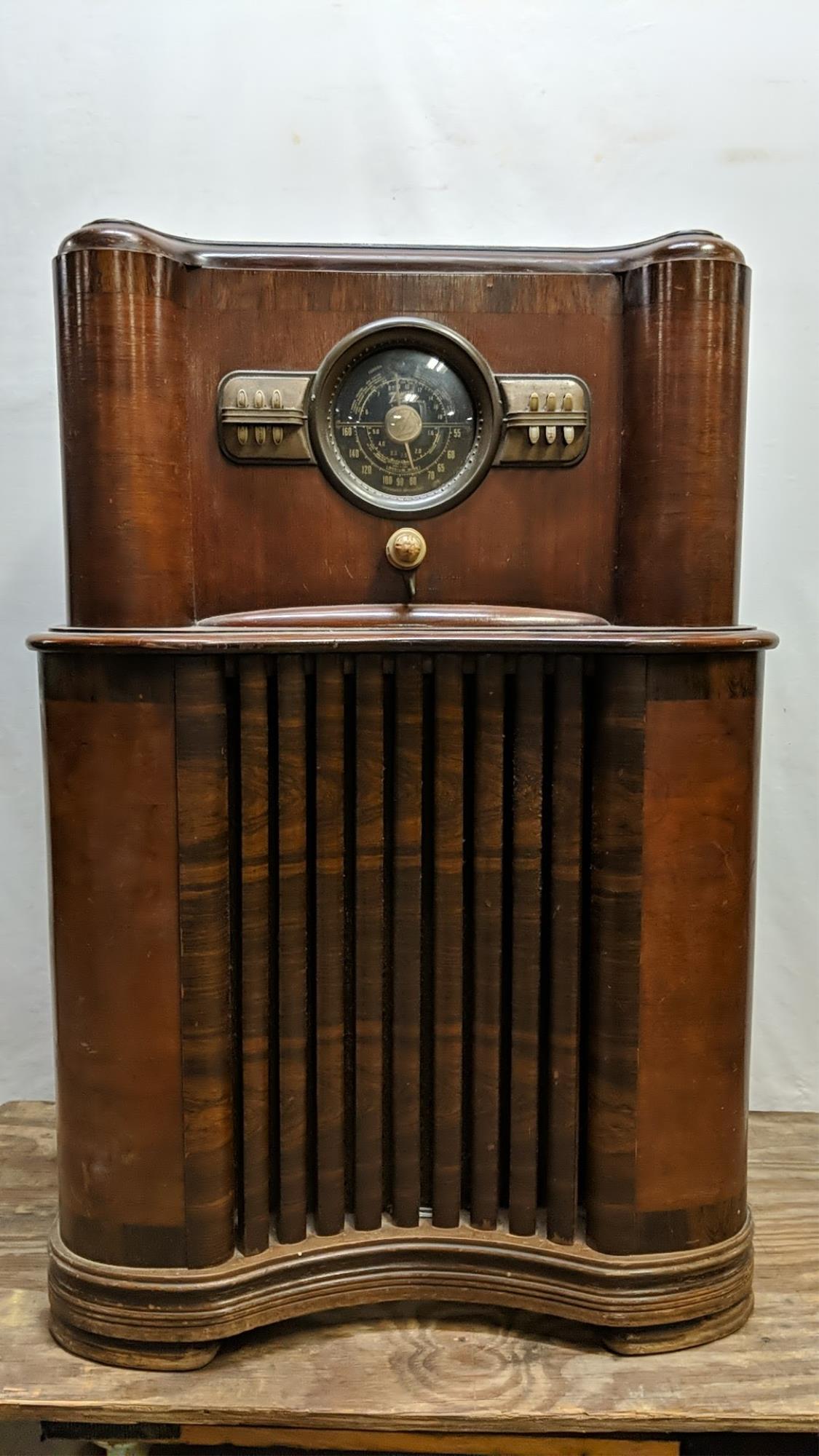 Antique Black Face Zenith Radio: Am Standard and Foreign Broadcase and shortwave lights up but can't pick up any sound 41" T x 28" W x 16" D Top is a little rough
