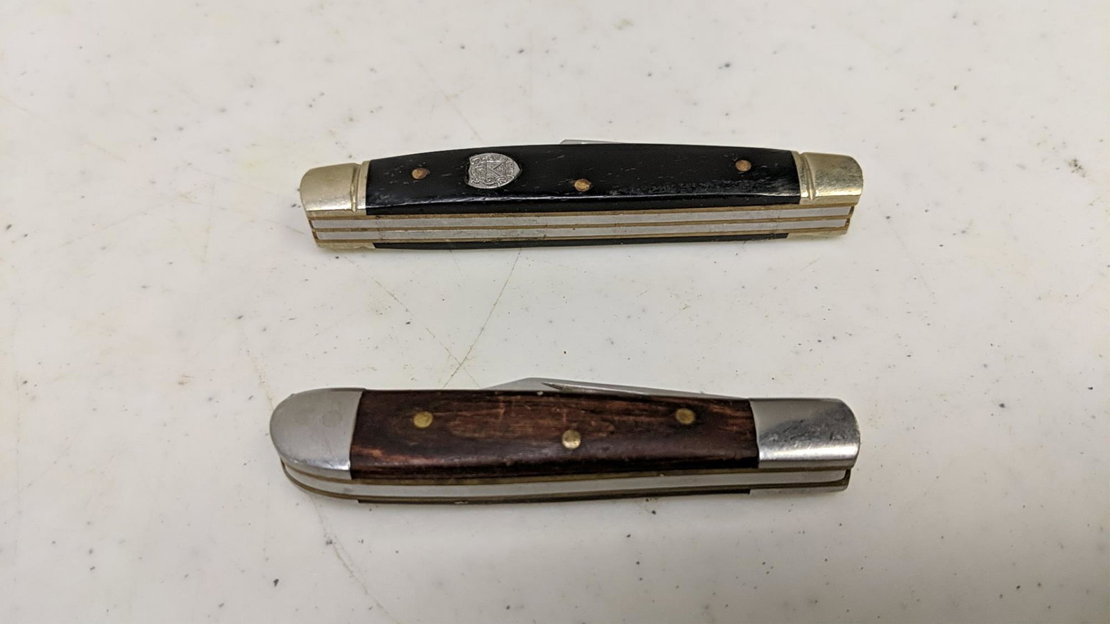 1 frost cutlery and 1 Winchester knife: 3 1/4" closed and 2 3/4" closed