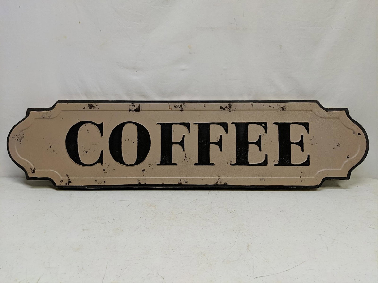 Embossed coffee sign (1 of 1)