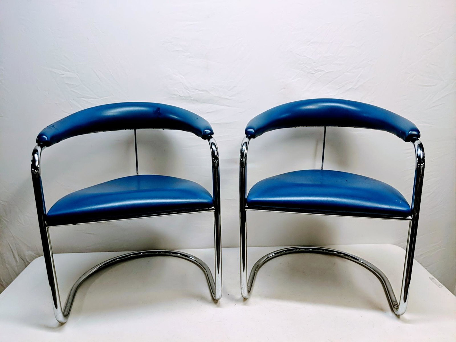 pair of Anton Lorenz chairs by Thonet chairs: Model # 5535 Blue with chrome bases 23" w x 19" D x 29 1/2" T has some damage on the arms See pictures