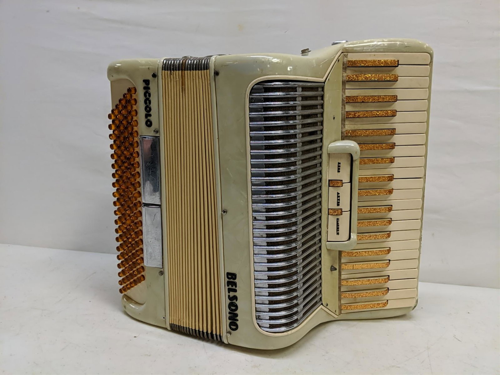 Belsono Piccolo Accordian - original case: has crack in body of accordian used condition case measures 19" W x 11" d x 17 1/2" T