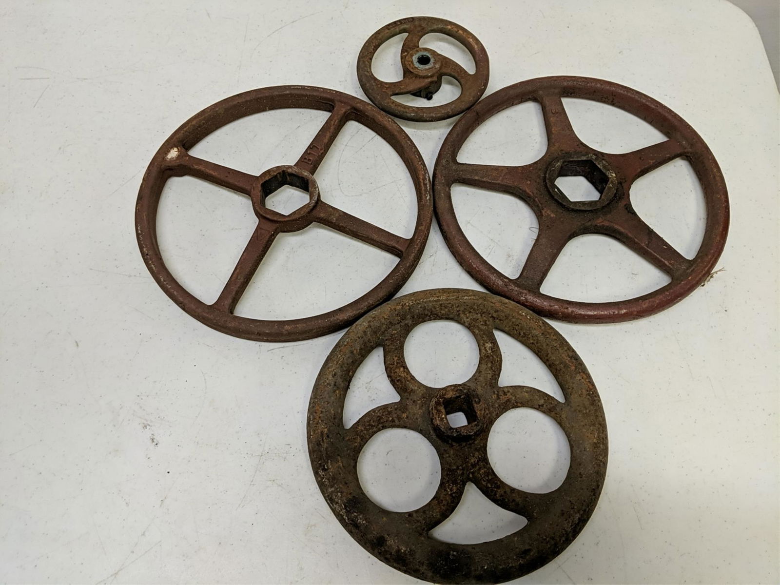 4 Assorted size cast iron valve wheels (1 of 1)
