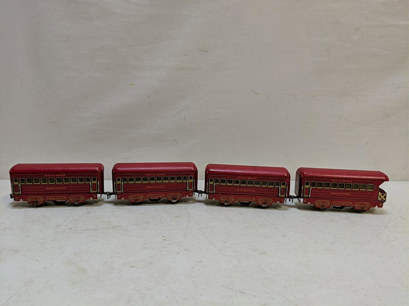 4 Marx 1930's train cars: 3 pullman cars and 1 caboose all 6" L