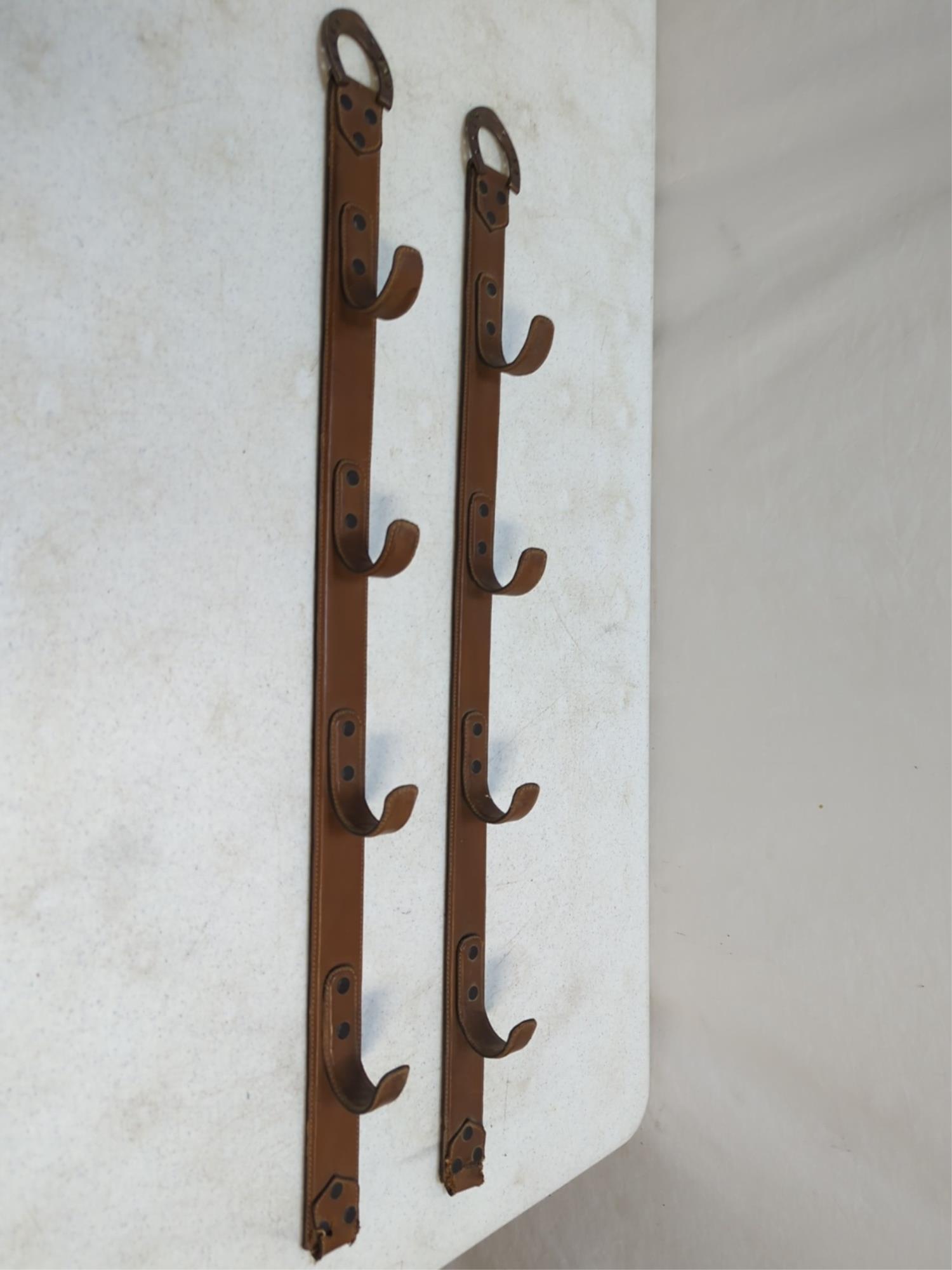 Leather over metal gun rack: holds 4 guns horse shoe hangers 34 1/2" L