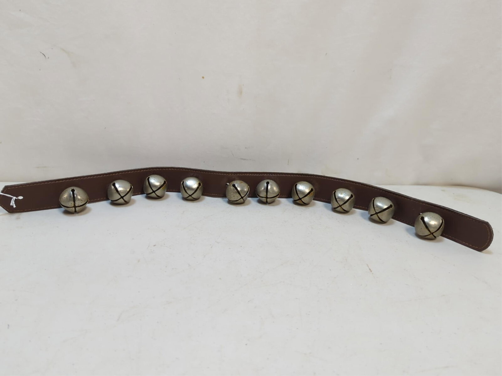 sleigh bell on leather strap (1 of 1)