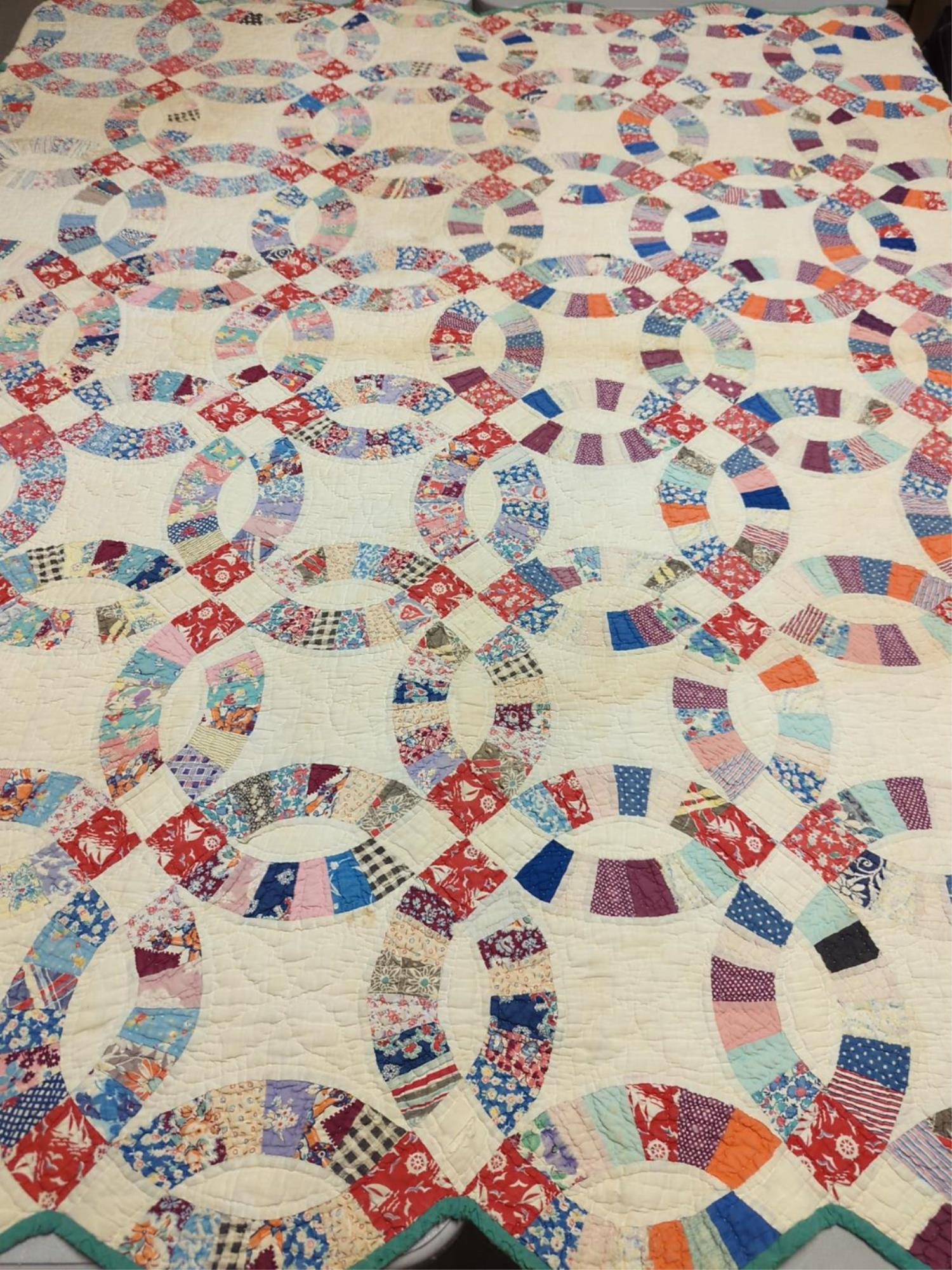 Very Early double wedding ring quilt: hand stitched and hand quilted some tattered places, some stains 74" x 64"