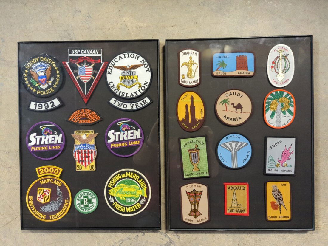 2 displays with patches: one display is mixed fishing, Police & Johnstown Motorcycle Rally one is all Saudi Arabis patches 12" W x 16" t
