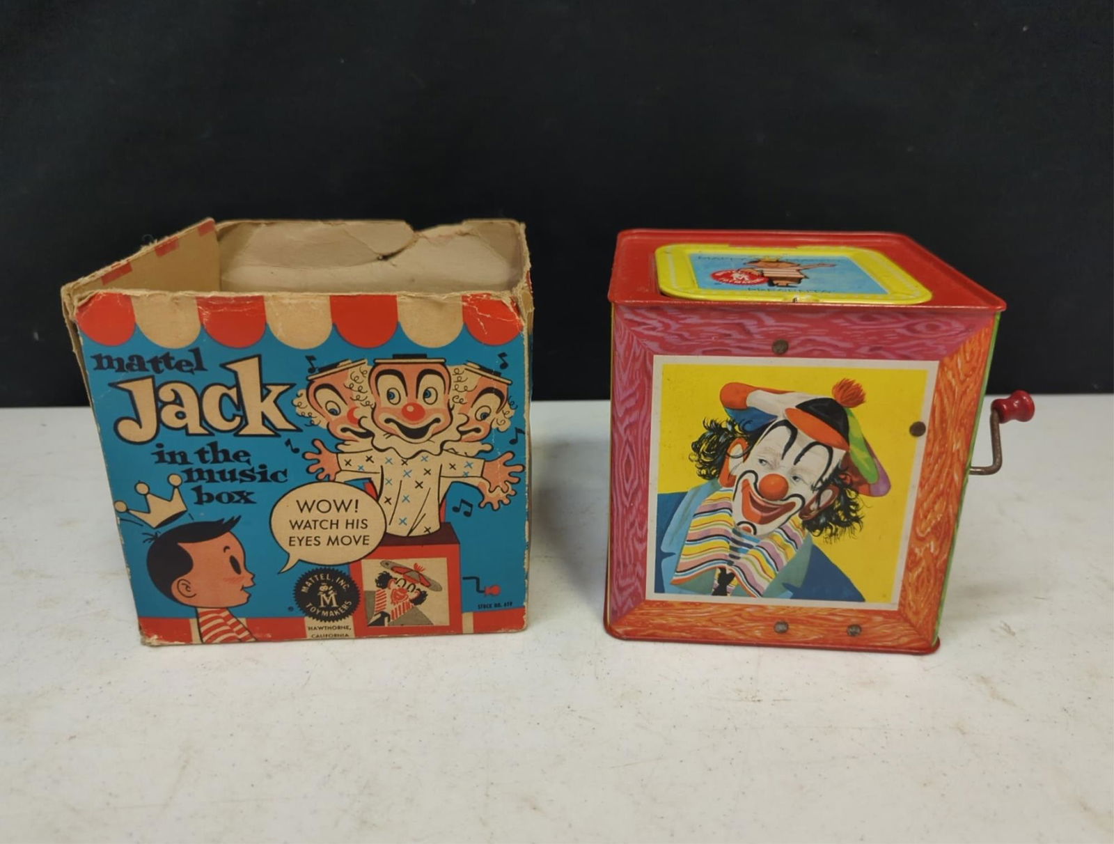 Mattel 1961 all metal Jack in the Box Clown: works in original box missing lid 5 1/4" sq. x 5 1/2" T