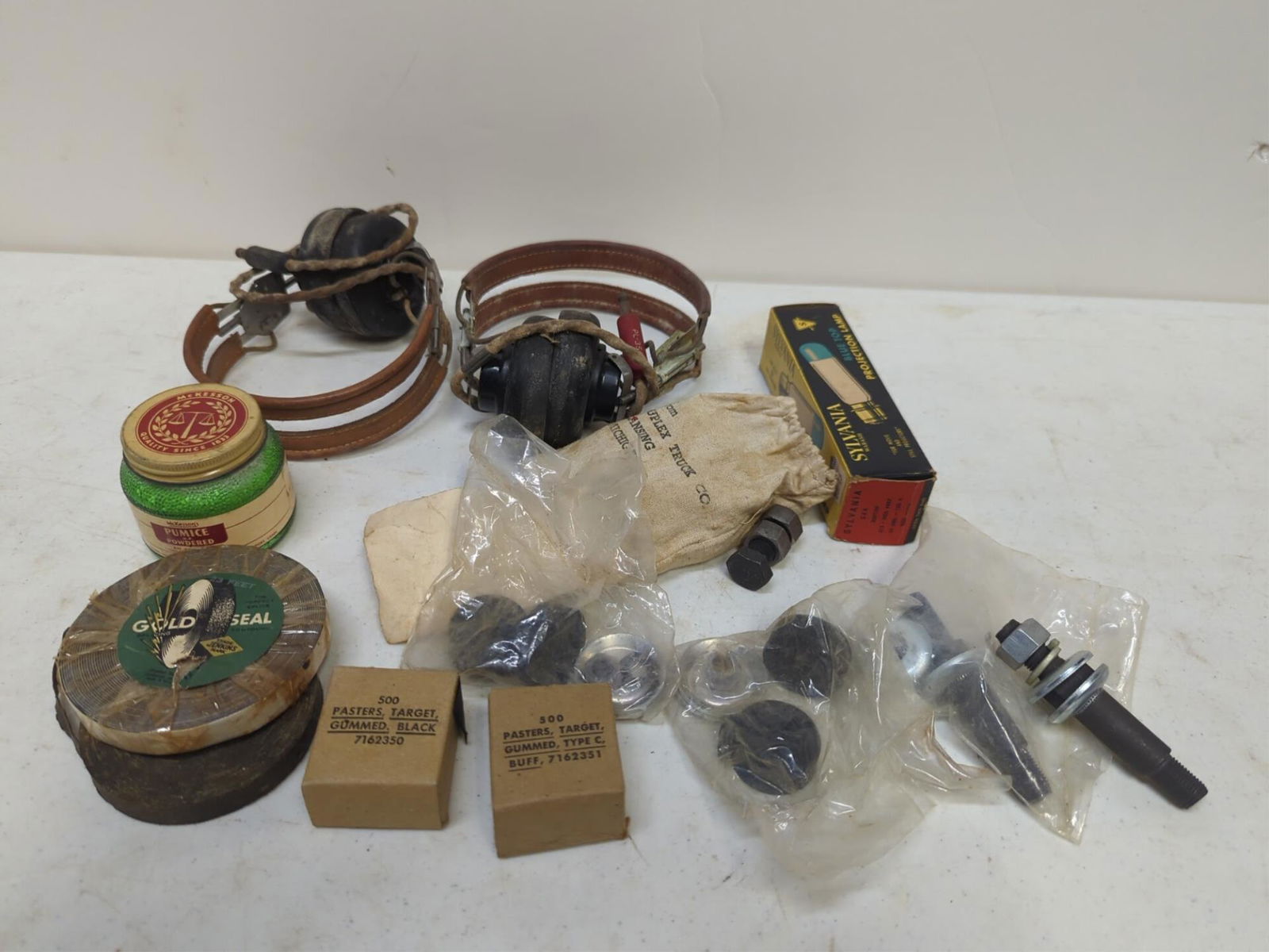 Headphones, radio parts and misc. items: projector lamp, pumice, tape, washers, etc.