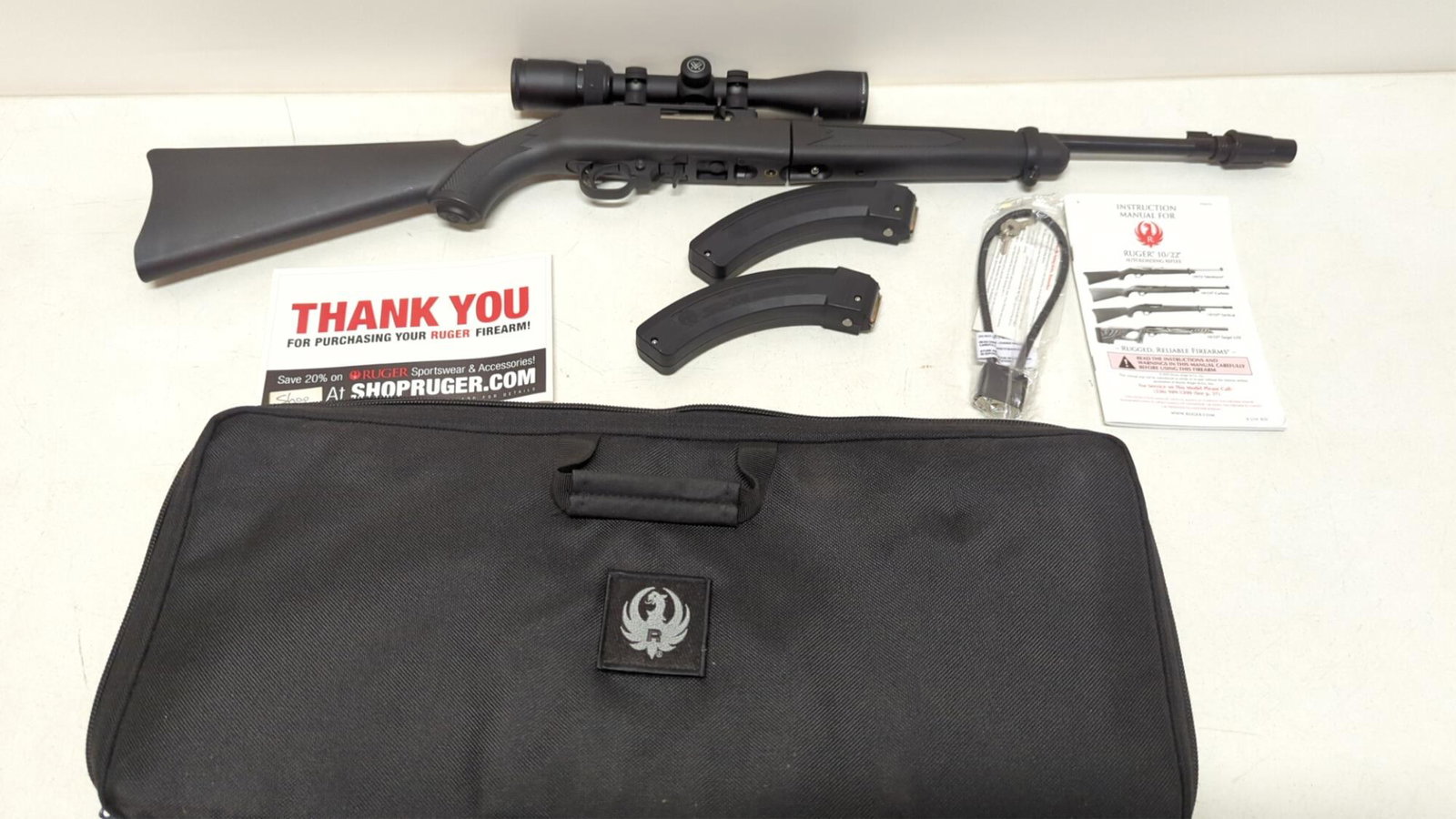 Ruger 10 / 22 carbine rifle: includes Vortex Diamond Back Scope 2 - 7 x 3537" L gun lock and carry case Like New Condition SN # 0014 - 23870