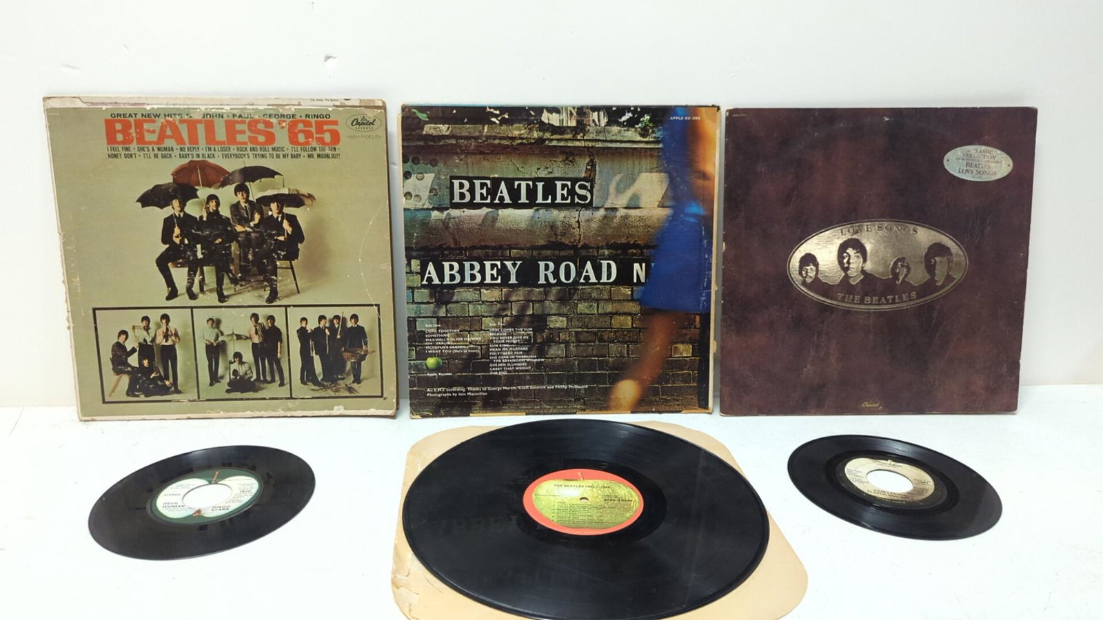 (7) Vintage Beatle Records: 33 1/3 Abbey Road, Beatles '65, Beatles Love songs, 2 Records Beatles 1962 - 1966, 45rpm - Devil woman & your Sizteen by Ringo, Imagine & Its so hard - John Lennon, Couple records covers are Rough and