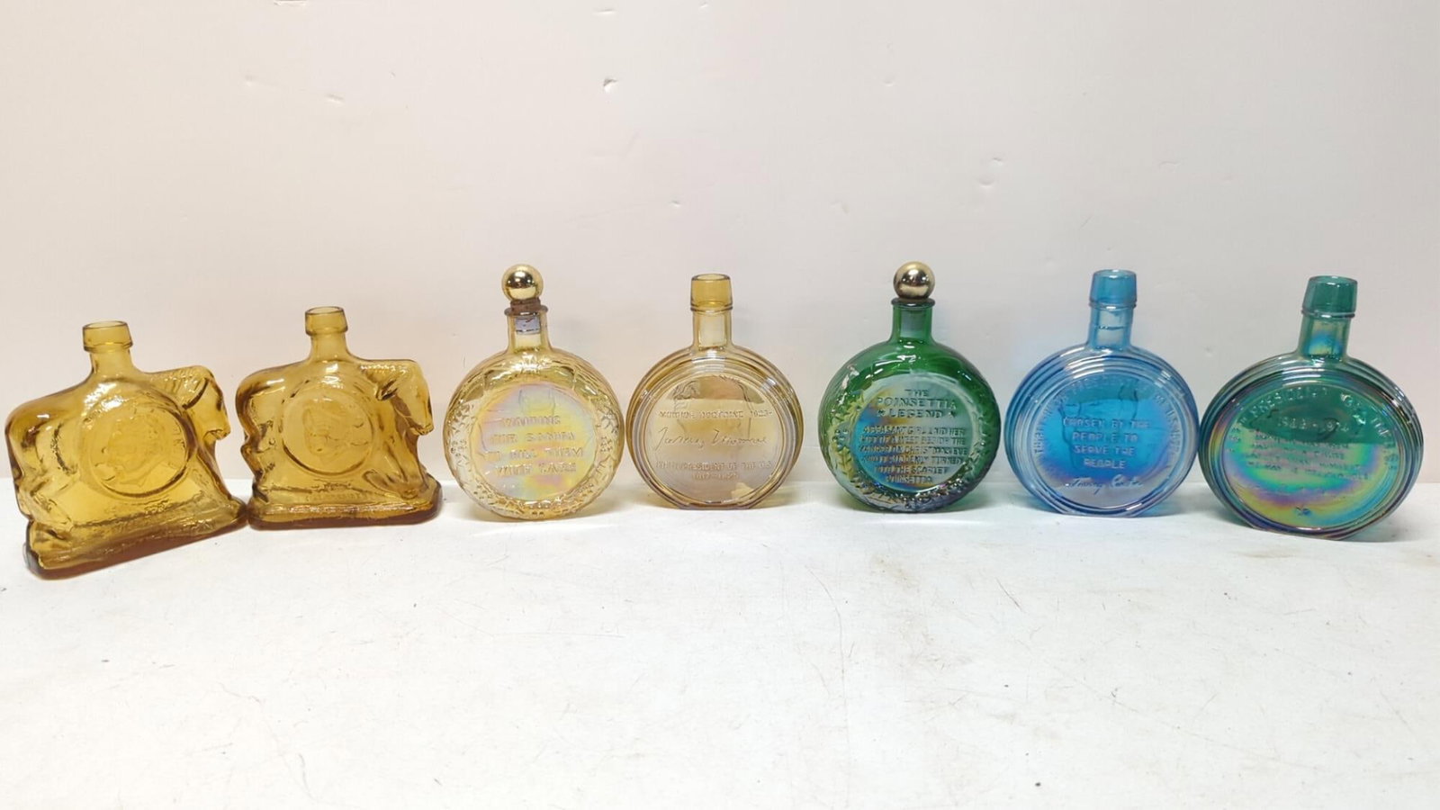 7 Vintage Wheaton 9" Tall bottles: Nixson, Carter, Monroe ,(2) Christmas, Shriver 72 and Eagleton 72 6" Wide