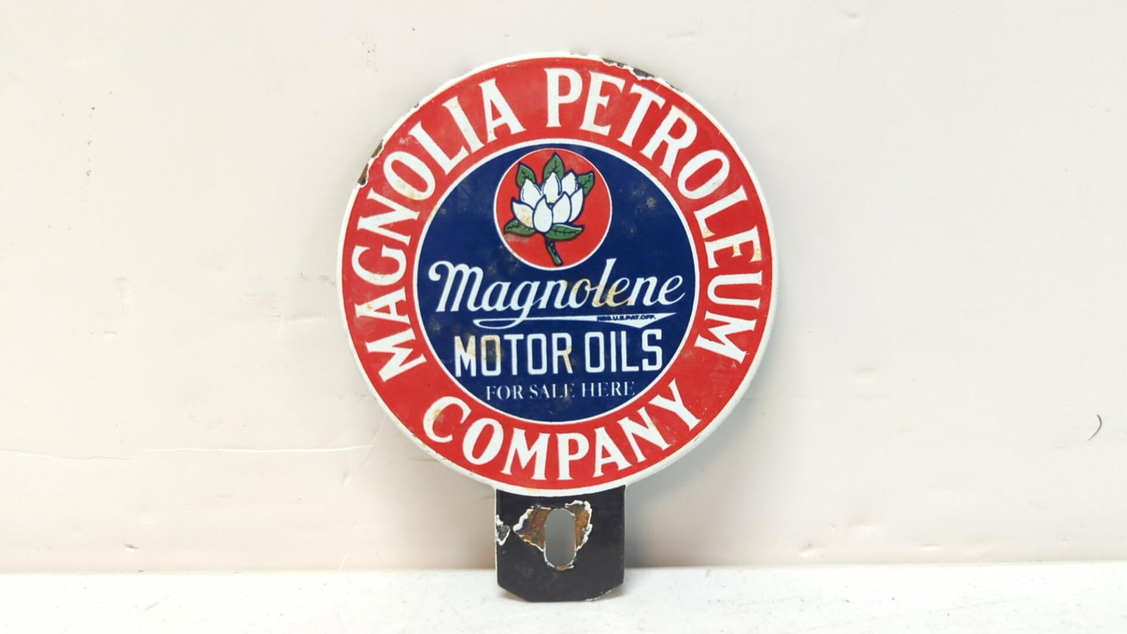Magnolia Petroleum Co., Porcelain Tag Topper: 4" W x 5" T some dings on perimeter and mounting hole