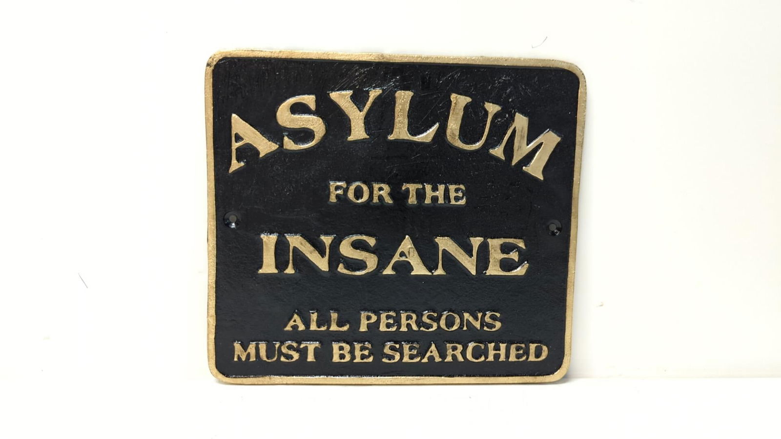 Asylum for the Insane sign (1 of 2)