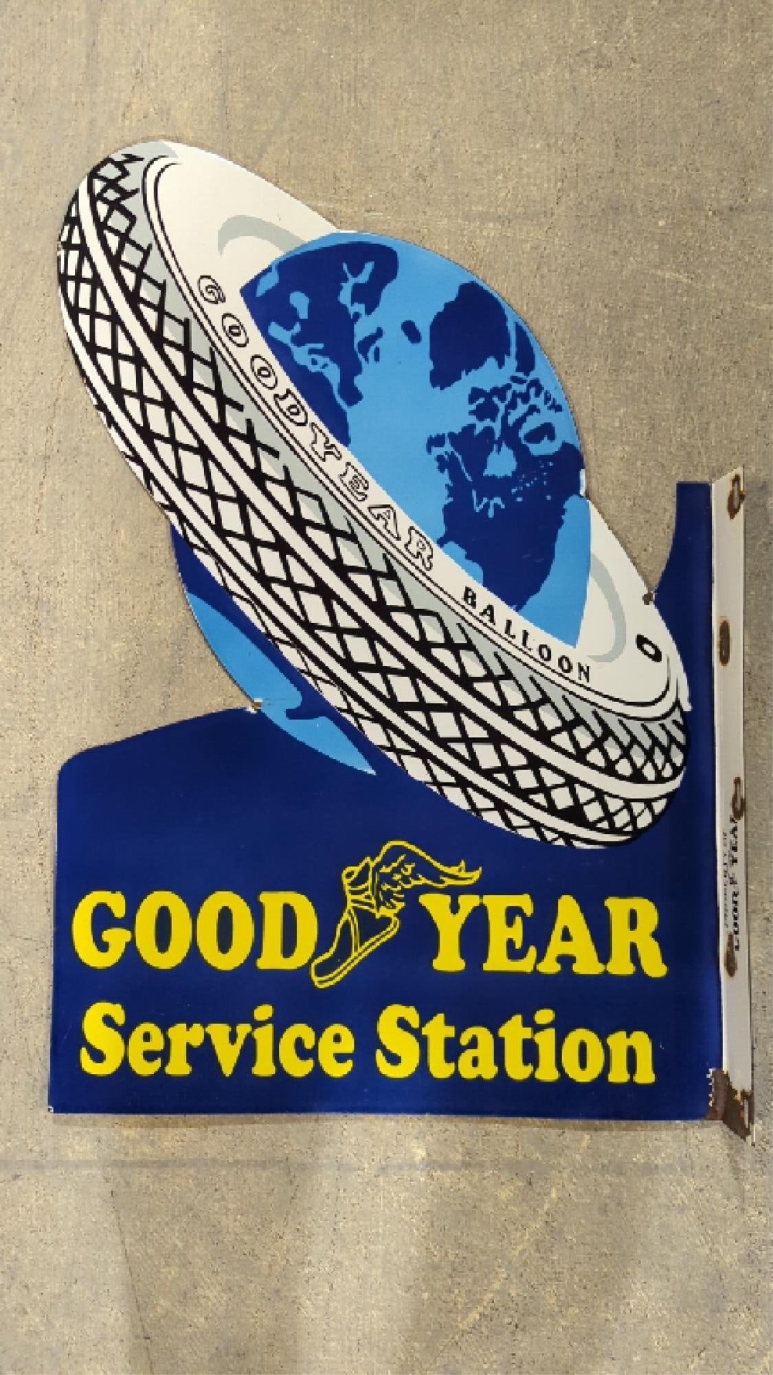 Porcelain Goodyear Flange double sided sign: 30" x 20" some dings and corrosion to perimeter, mounting holes and interior