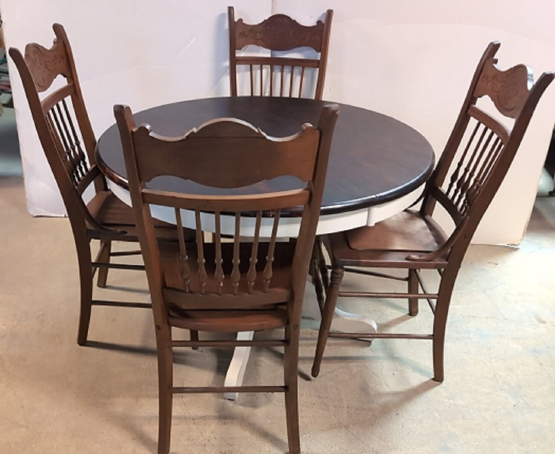 42" round table with 4 press back chairs: table has white base and dark top chairs are solid wood and everything is in good condition