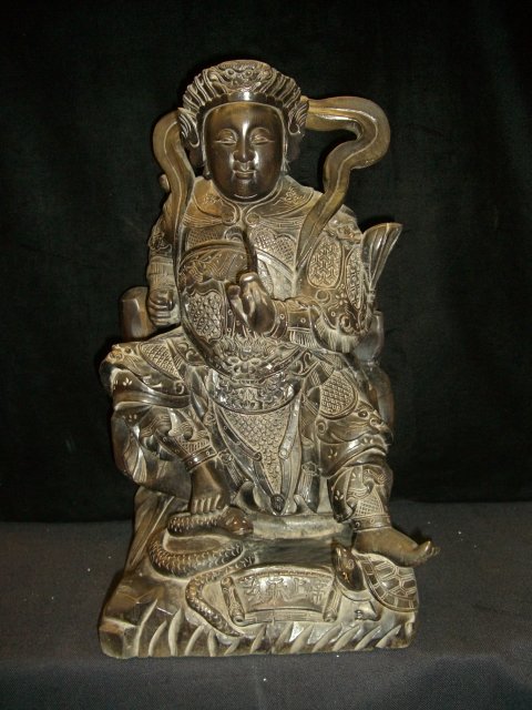 WOODEN XUAN TIAN SHANG DI GOD: SIZE:10"W, 9"L, 16"H. Tien god image shown now, gesturing with his sword cut off his right hand greed, aversion, and delusion three evil, bear left fingerprints Babel schematic beings return to heaven