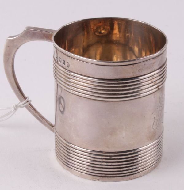 A George III silver christening mug by George Smit: A George III silver christening mug by George Smith II & Thomas Hayter, London 1796, with an angular loop handle, 'coopered' bands and engraved a monogram 'GSH', 6.5cm high, 3.5 oz