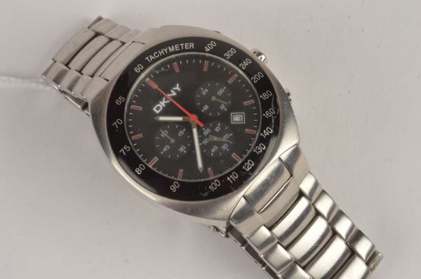 DKNY, a gentleman's stainless steel chronograph br: DKNY, a gentleman's stainless steel chronograph bracelet wristwatch, circa 2000, ref. NY 5063 no. 340406, the two piece screw down case with black tachymeter bezel, black dial, red baton numerals, lum