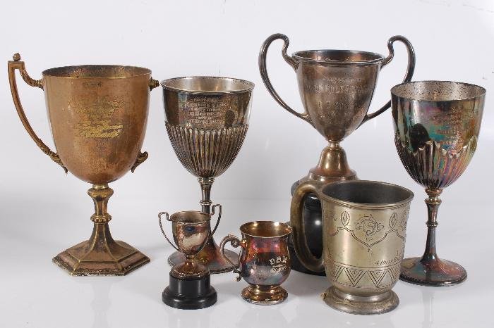 A collection of trophies, to include: a Victorian: A collection of trophies, to include: a Victorian silver trophy cup by Charles Stuart Harris, London 1893, engraved with a presentation inscription, a beaded knop stem and on a beaded circular foot, 2