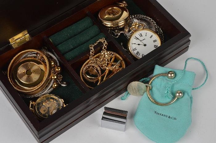 A Tiffany Co. key ring , the curved bar with b:  A Tiffany & Co. key ring, the curved bar with ball terminals, and with an inscribed circular tag, 1.16oz; a 9 carat gold signet ring, with a monogram, finger size P; various pocket watches;