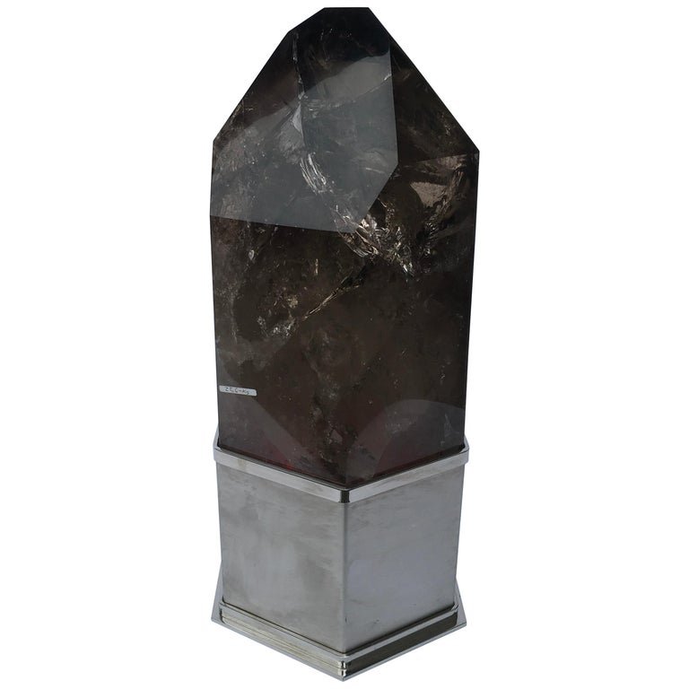 Hespirito Lamp by Studio Superego, Italy: Hespirito lamp with smoky grey quartz structure and stainless steel base designed and produced by Studio Superego in 2015. The lamp has a multicolored LED light bulb. Quartz weighs 25 kg.BiographySupe