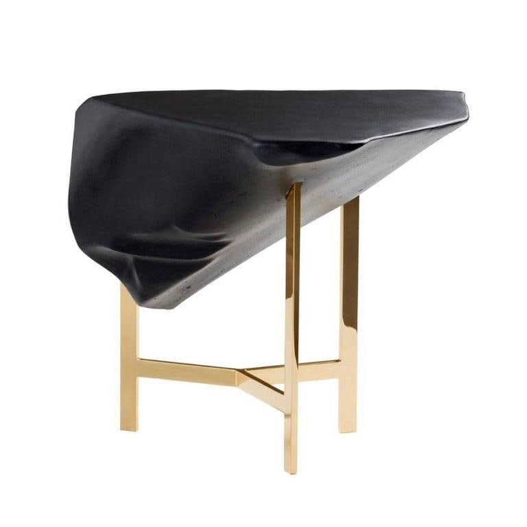 Side Table Basalt Model by Fredrikson Stallard for Driade: Much of Fredrikson Stallard us work is about fragmentation and deconstruction. There are many similarities between studying the beauty of the resulting forms, when deconstructing an object and the ven
