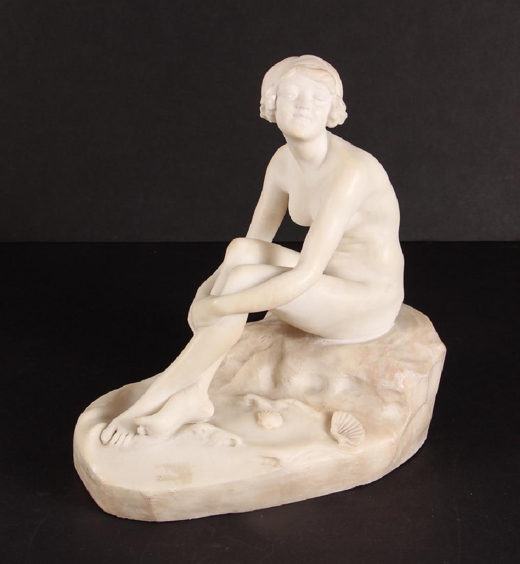 Fernando Vichi Seated Nude Sculpture: Vichi, Fernando (Italian, 1875-1945), seated nude on seashore,alabaster, measuring 11 by 10 by 6 inches, signed with location of Firenze, Italy.