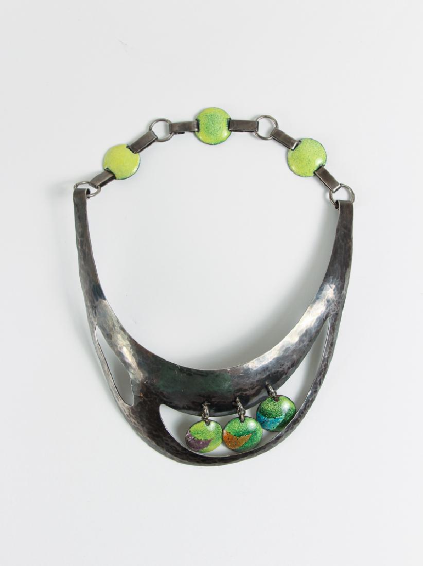 Virgil Cantini Enameled Choker Necklace 1960: This Virgil Cantini choker is a slice of hammered silver adorned with a trio of green enameled disks. Links of elongated metal attached to neon green enameled disks form a bold chain at the back of th