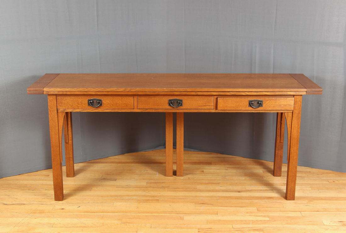 Stickley Flip Top Harvest Table: Harvest table, with a flip top, in oak, with three drawers with hammered copper pulls, by Stickley, measuring 19 by 72 by 30.5 inches.