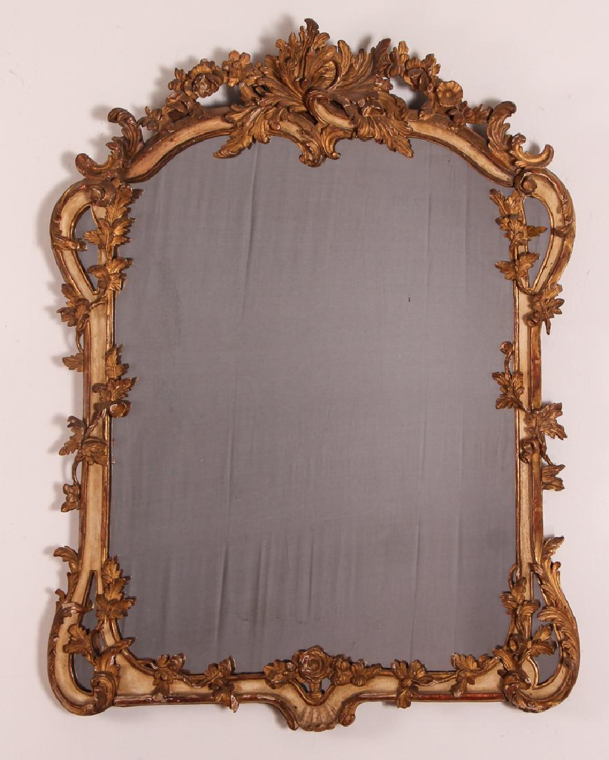 Antique Italian Carved Wood Mirror: Mirror, antique, carved wood, painted and gilt, measuring 40 by 31 overall with the mirror portion being 30 by 24 inches. Provenance: Steinbrenner collection, Pittsburgh, PA.