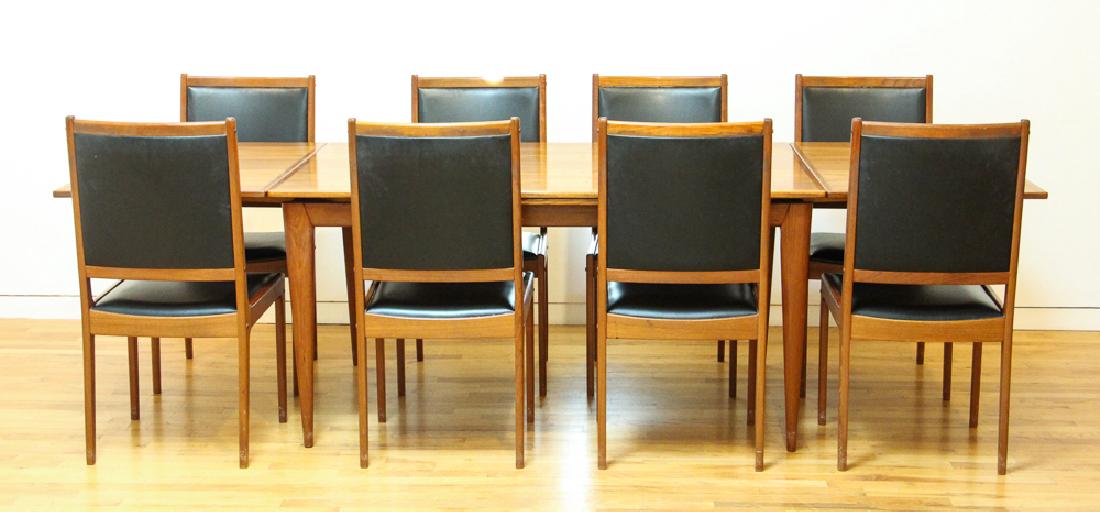 J L Moller Danish Mid Century Dining Table and Chairs: Moller, JL, Dining table and eight chairs, Danish, teak, mid century, with metallic tag underneath, measuring 29 by 39 by 59 inches with two integral leaves of 23 inches each. Chairs, 37 by 18 by 18 i