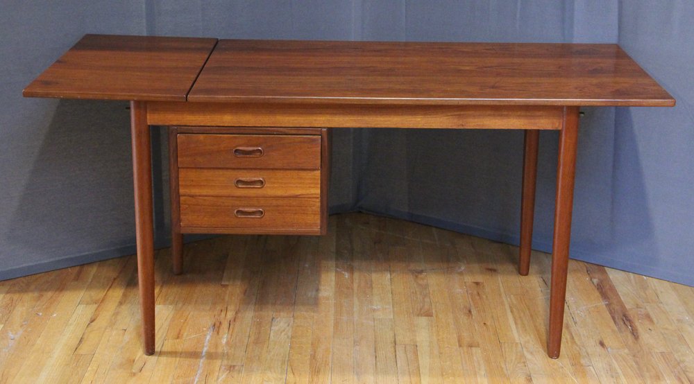 Arne Vodder Desk Model 51A in Teak: Vodder, Arne, compact teak desk, 1960s, Teak veneer wooden desk, The single drawer stack has three drawers with recessed pulls in matching teak wood. The work space has a dropped leaf on the left side