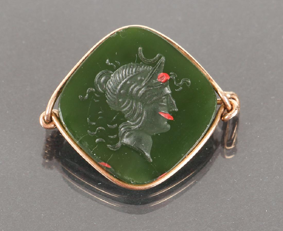 Bloodstone Mercury Intaglio Gold Set Pin: Bloodstone mercury fob, set as a pin in a wire setting, unmarked by probably 14 karat gold, approximately 1 inch across.